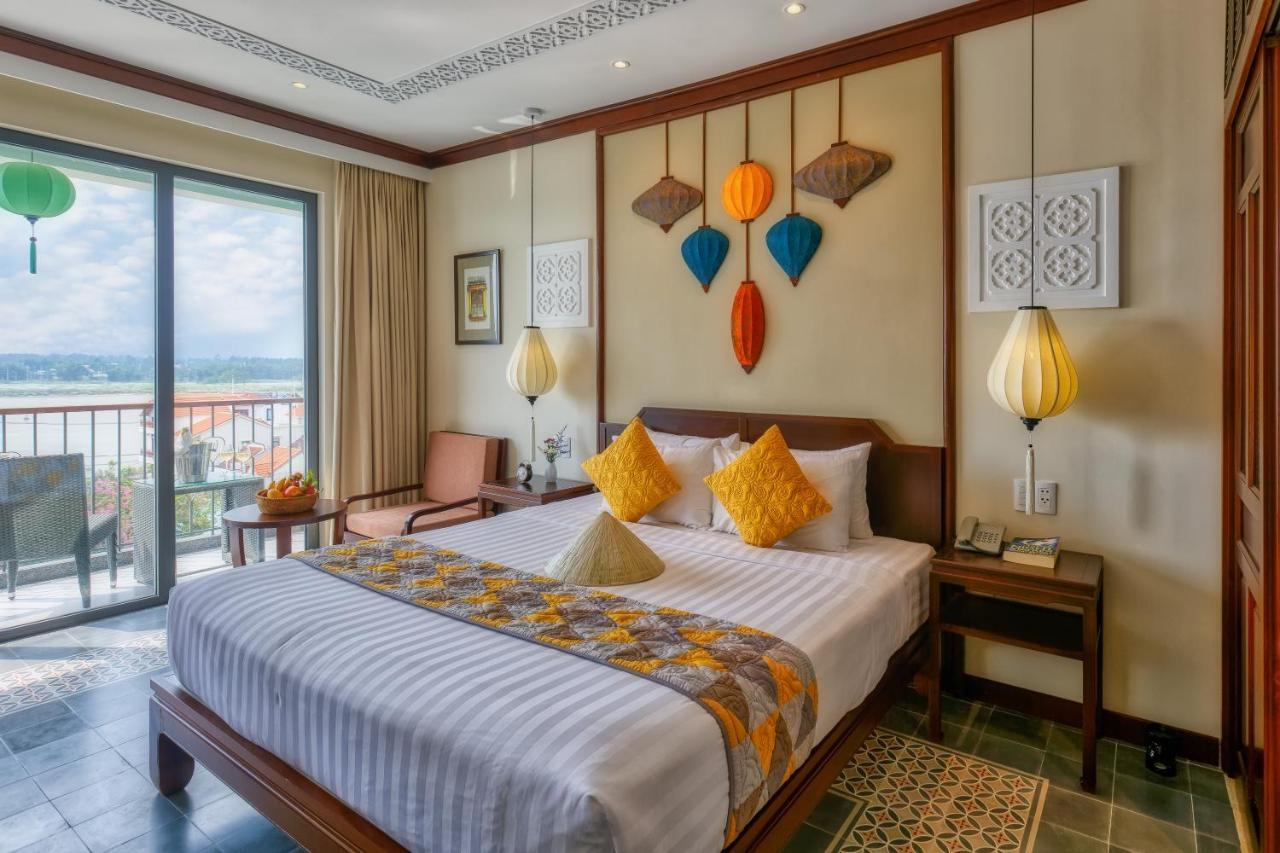 Cozy Savvy Boutique Hotel Hoi An Bagian luar foto A room at the hotel