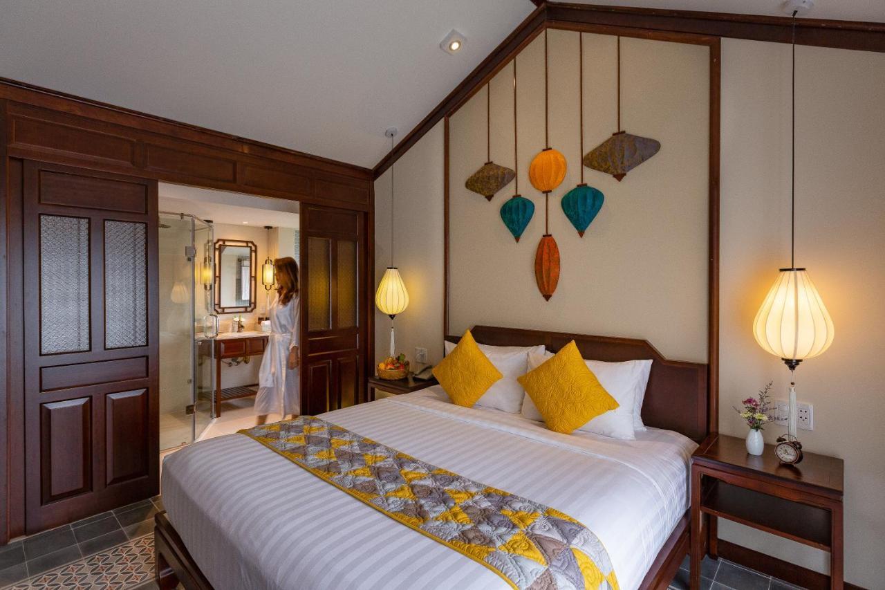 Cozy Savvy Boutique Hotel Hoi An Bagian luar foto A room at the hotel