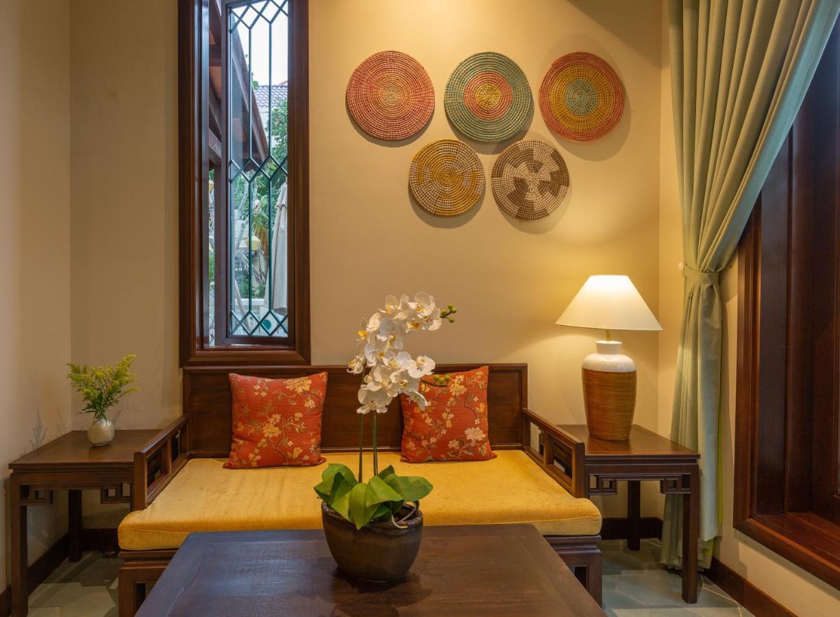 Cozy Savvy Boutique Hotel Hoi An Bagian luar foto Interior of a suite at the hotel
