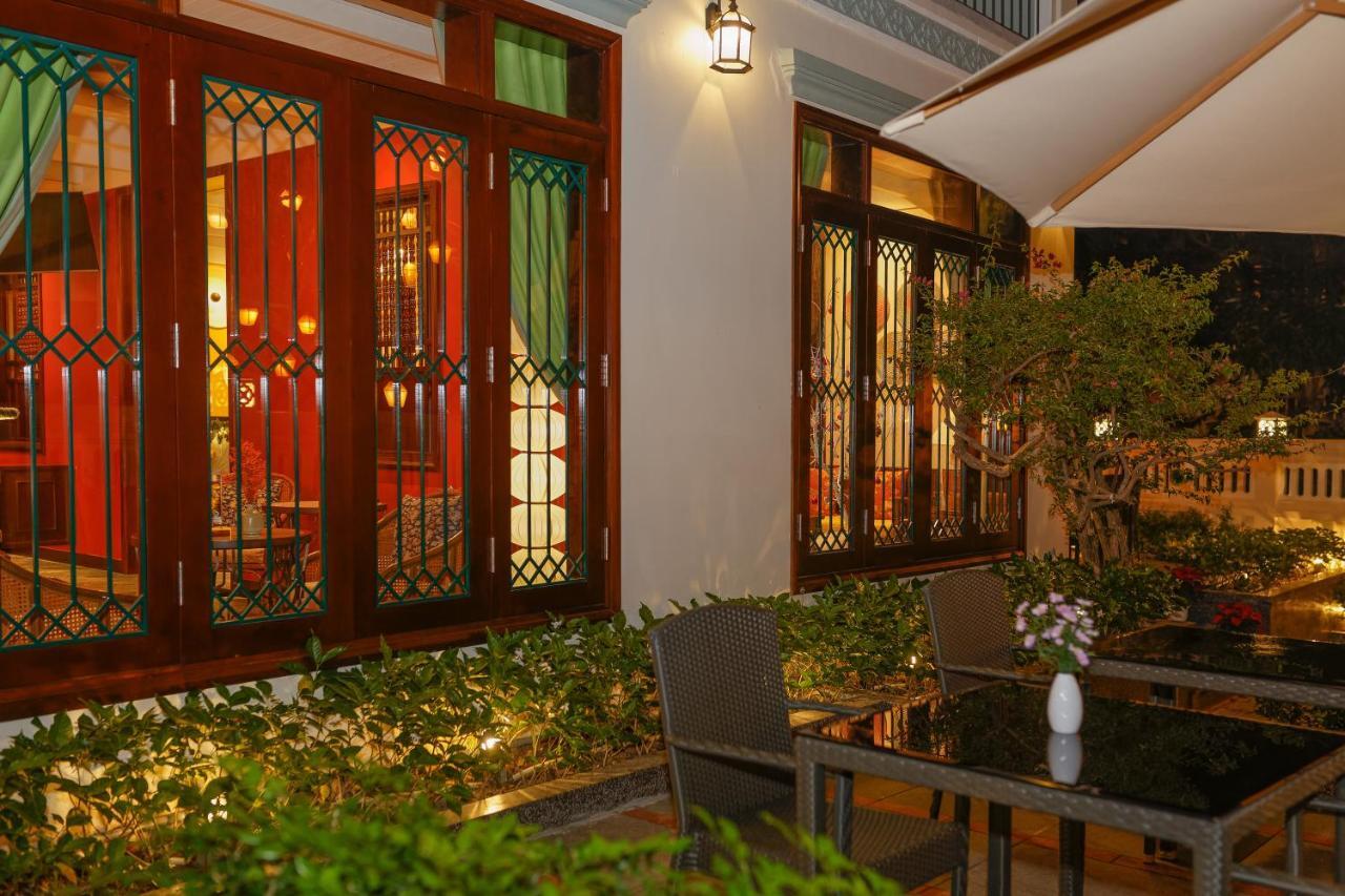 Cozy Savvy Boutique Hotel Hoi An Bagian luar foto The interior of the restaurant